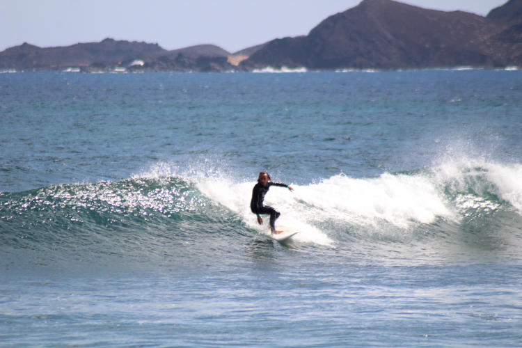 man surfing a righthander wave